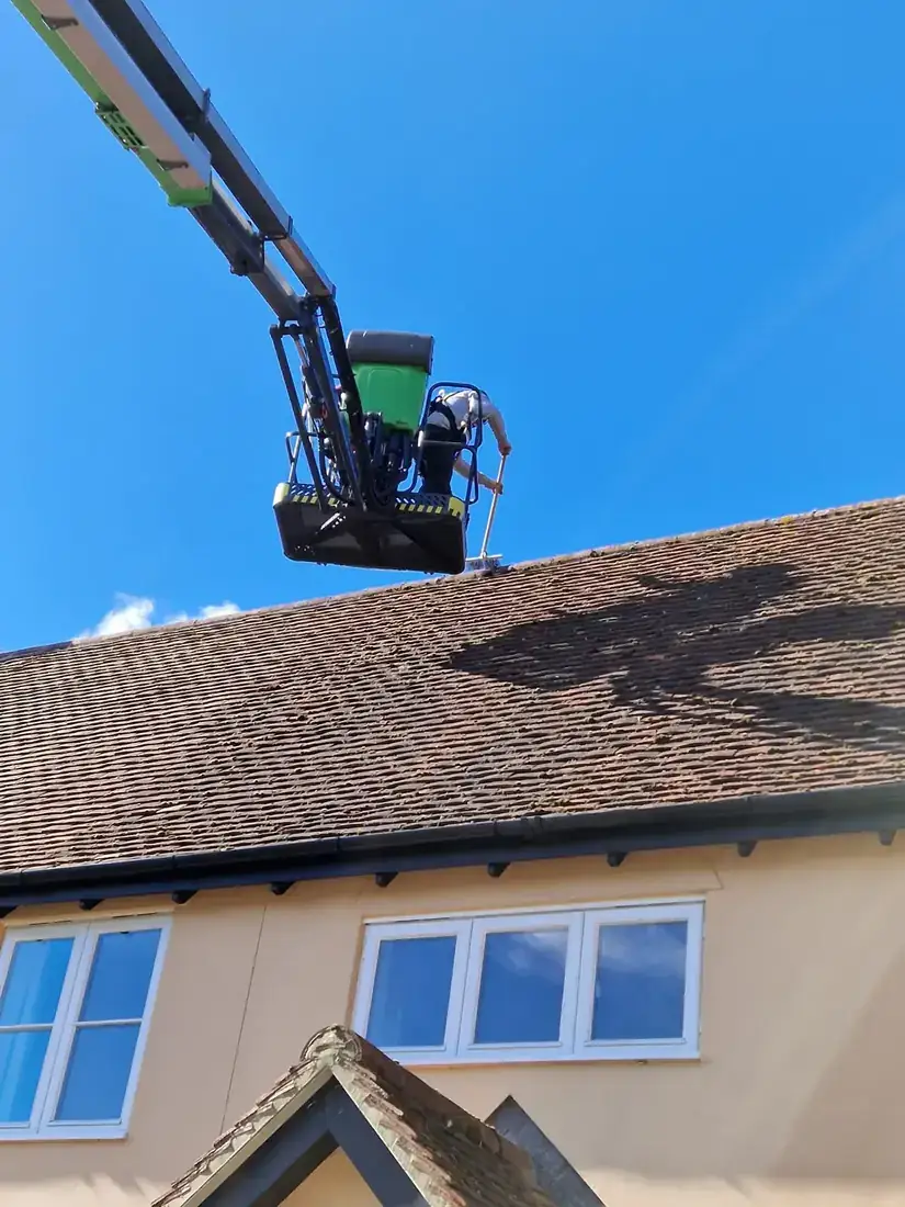 Working from a powered access platform at roof edge height